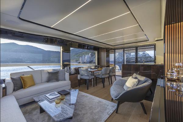 Slide: The Image of Luxurious interior of the 2024 Absolute Navetta 64 yacht with panoramic ocean views. - 12