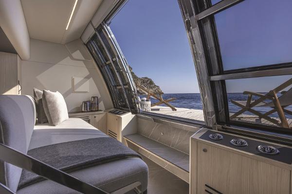 Slide: The Image of Luxurious interior of the 2024 Absolute Navetta 64 yacht with ocean view. - 5