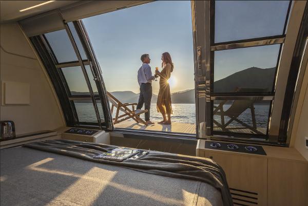 Slide: The Image of Couple enjoying sunset on Absolute Navetta 64 yacht, 2024 model, with scenic ocean view. - 6