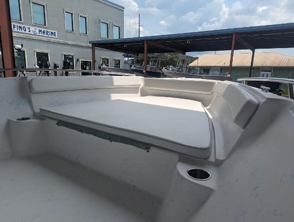 Slide: The Image of 2024 ALK2 Powerboats 22 CRX interior view at a marina. - 10