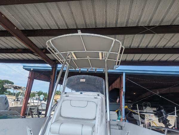 Slide: The Image of 2024 ALK2 Powerboats 22 CRX under a metal roof at a marina. - 12