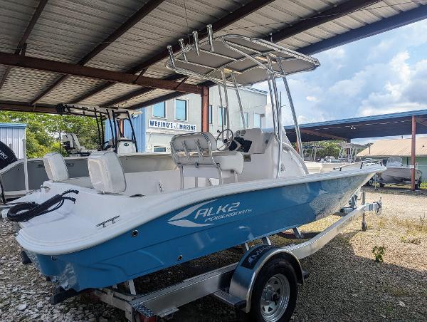 Slide: The Image of 2024 ALK2 Powerboats 22 CRX on trailer under a metal canopy. - 3