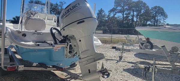 Slide: The Image of 2024 ALK2 Powerboats 22 CRX with Suzuki outboard motor in a boatyard. - 5
