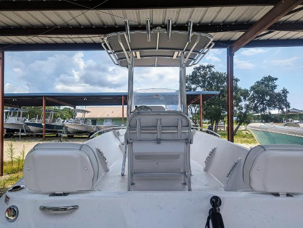 Slide: The Image of 2024 ALK2 Powerboats 22 CRX center console boat under a covered dock. - 7