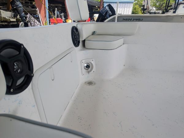 Slide: The Image of Interior of 2024 ALK2 Powerboats 22 CRX, featuring seating and speaker system. - 8