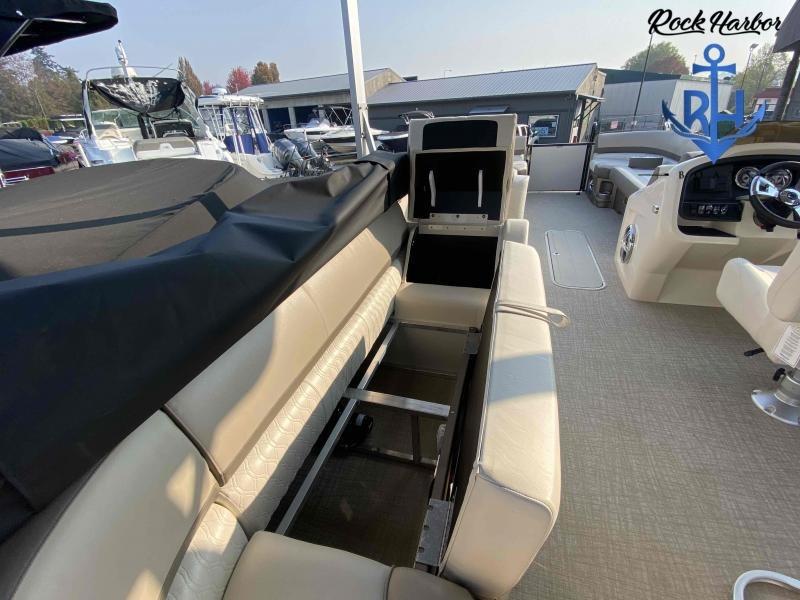 Slide: The Image of 2023 Avalon 2585 Catalina Cruise Funship interior with open storage compartments. - 16