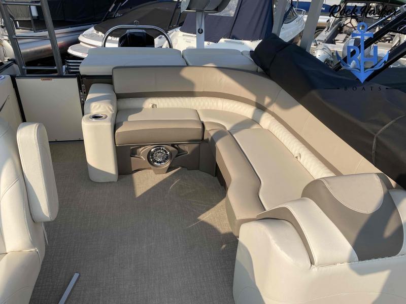 Slide: The Image of 2023 Avalon 2585 Catalina Cruise Funship interior with beige seating and cup holders. - 17