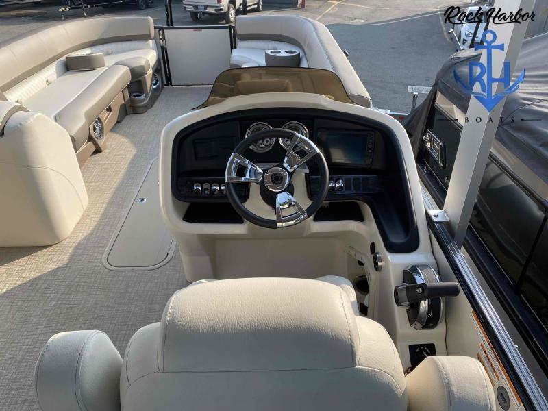 Slide: The Image of 2023 Avalon 2585 Catalina Cruise Funship boat interior with steering wheel and seating. - 18