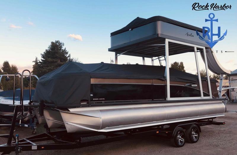 Slide: The Image of 2023 Avalon 2585 Catalina Cruise Funship pontoon boat on trailer at Rock Harbor. - 2
