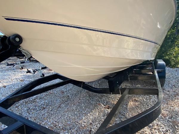 Slide: The Image of 2001 Bayliner 215 Bowrider boat on a trailer, close-up of the hull. - 29
