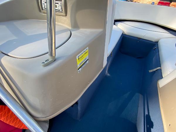 Slide: The Image of 2001 Bayliner 215 Bowrider interior seating and storage area. - 8