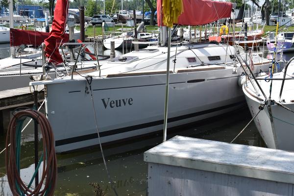 Slide: The Image of 2012 Beneteau First 30 sailboat named Veuve docked at a marina. - 0