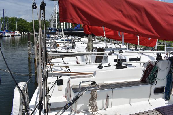Slide: The Image of Beneteau First 30 sailboats docked at a marina, 2012 model. - 12