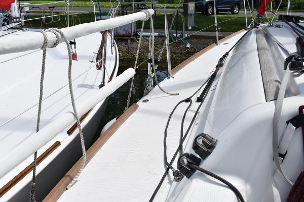 Slide: The Image of Beneteau First 30 (2012) sailboat deck with rigging and docked at marina. - 17