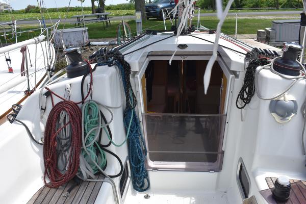 Slide: The Image of Beneteau First 30 sailboat cockpit, 2012 model, with ropes and winches. - 19