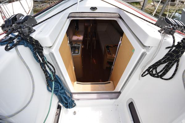 Slide: The Image of Beneteau First 30 2012 sailboat cockpit view with open cabin door. - 20