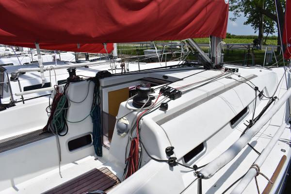 Slide: The Image of 2012 Beneteau First 30 sailboat with red sail cover, docked and ready for sailing. - 7