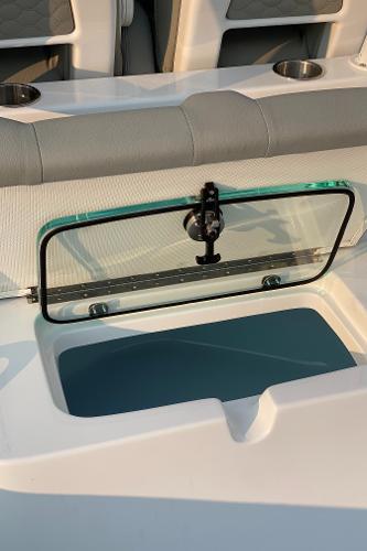 Slide: The Image of 2024 Cape Horn 34 XS boat with open storage compartment and cushioned seating. - 20