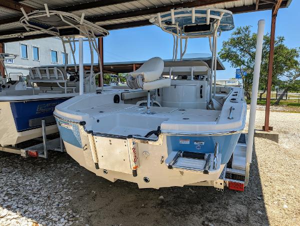 Slide: The Image of 2022 Carolina Skiff 24 Ultra Elite boat displayed in a covered outdoor area. - 1