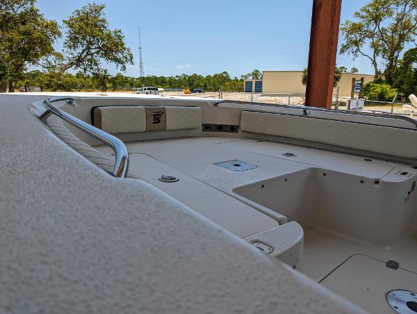 Slide: The Image of 2022 Carolina Skiff 24 Ultra Elite boat interior, spacious seating and storage. - 11