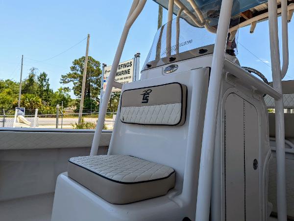 Slide: The Image of 2022 Carolina Skiff 24 Ultra Elite boat interior with cushioned seating. - 12