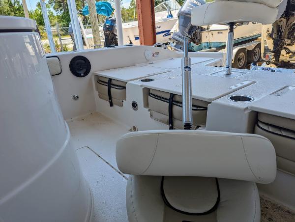Slide: The Image of 2022 Carolina Skiff 24 Ultra Elite boat interior with seating and storage compartments. - 8