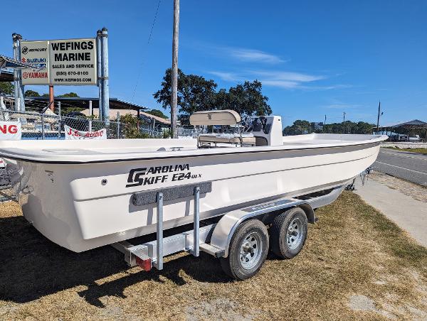 Slide: The Image of 2024 Carolina Skiff E Series 24ft CC boat on trailer at Wefings Marine. - 1