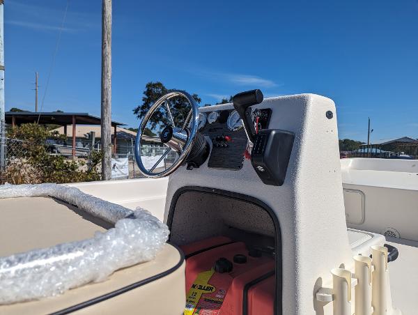 Slide: The Image of 2024 Carolina Skiff E Series 24ft CC center console with steering wheel and controls. - 6