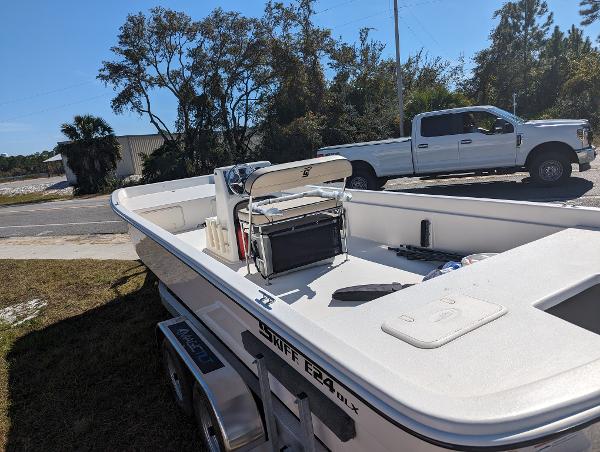 Slide: The Image of 2024 Carolina Skiff E Series 24ft CC boat on trailer, parked outdoors. - 9