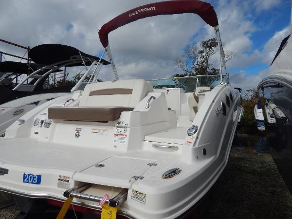 Slide: The Image of 2013 Chaparral 225 SSi boat with red canopy, rear view. - 10