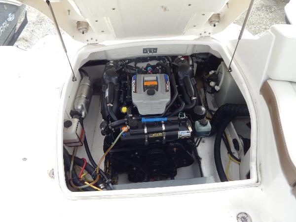 Slide: The Image of 2013 Chaparral 225 SSi boat engine compartment with open hatch. - 16