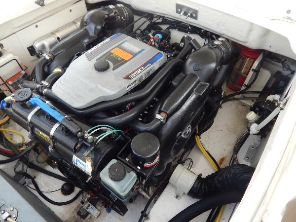 Slide: The Image of 2013 Chaparral 225 SSi boat engine compartment with 350 MAG MPI engine. - 18