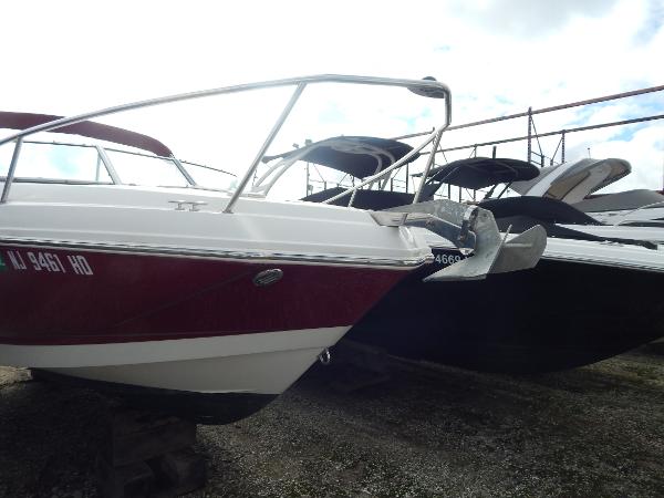 Slide: The Image of 2013 Chaparral 225 SSi boat in storage yard. - 2