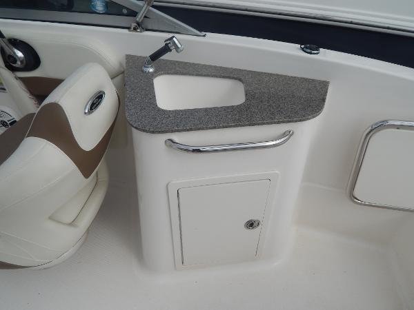 Slide: The Image of 2013 Chaparral 225 SSi boat interior sink and storage compartment. - 22