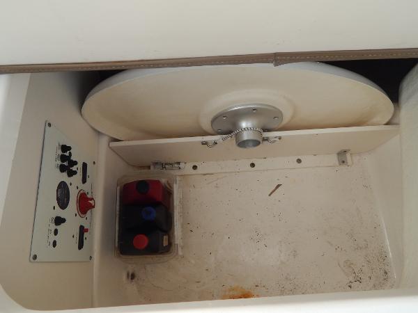 Slide: The Image of Control panel and storage compartment of 2013 Chaparral 225 SSi boat. - 24