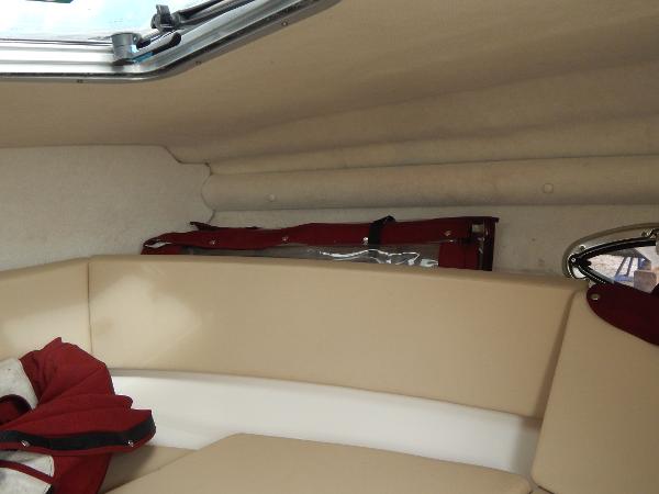 Slide: The Image of Interior cabin of a 2013 Chaparral 225 SSi boat with beige seating. - 28