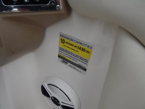 Slide: The Image of 2013 Chaparral 225 SSi boat capacity label, 10 persons or 1430 lbs limit. - 34