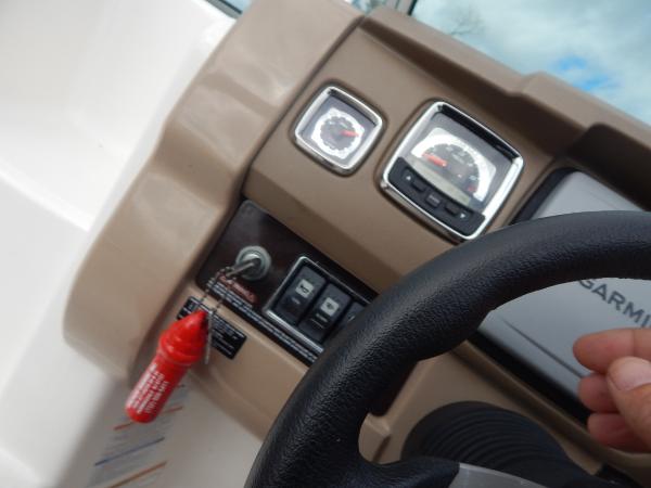 Slide: The Image of Close-up of 2013 Chaparral 225 SSi boat dashboard and steering wheel. - 38