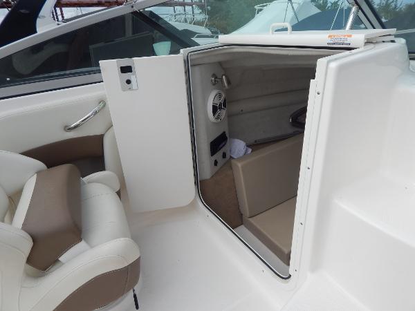 Slide: The Image of 2013 Chaparral 225 SSi boat interior cabin with seating and speaker. - 40