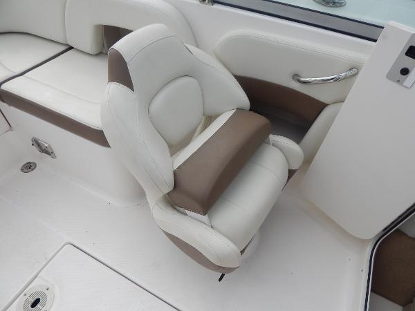 Slide: The Image of 2013 Chaparral 225 SSi boat interior with white and brown seating. - 41