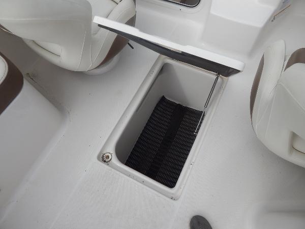 Slide: The Image of Open storage compartment on a 2013 Chaparral 225 SSi boat. - 43