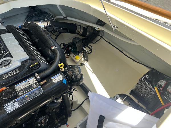 Slide: The Image of 2020 Chris-Craft Capri 21 engine compartment with 300 HP engine and battery. - 20
