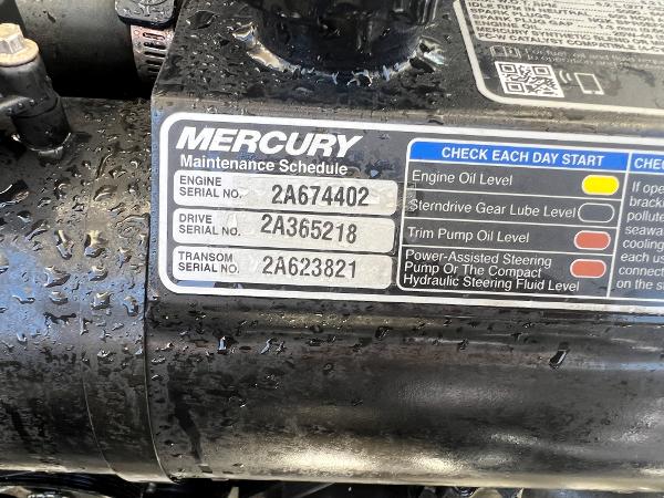 Slide: The Image of Mercury engine maintenance schedule label on a 2020 Chris-Craft Capri 21. - 22