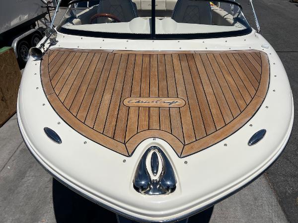 Slide: The Image of 2020 Chris-Craft Capri 21 boat with teak deck and sleek design. - 4