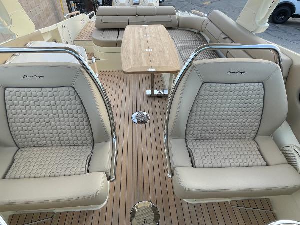 Slide: The Image of Luxurious interior of 2024 Chris-Craft Launch 31 GT with elegant seating and wooden flooring. - 14