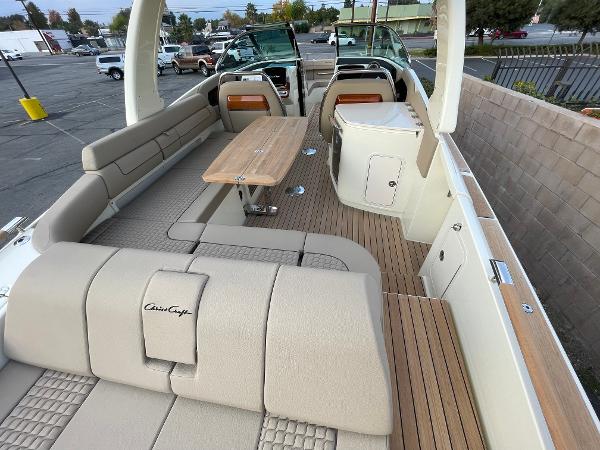 Slide: The Image of 2024 Chris-Craft Launch 31 GT interior with beige seating and wooden accents. - 5