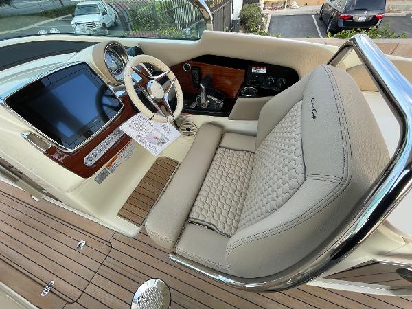 Slide: The Image of 2024 Chris-Craft Launch 31 GT cockpit with luxurious seating and modern dashboard. - 7