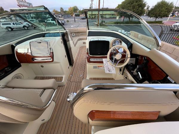 Slide: The Image of 2024 Chris-Craft Launch 31 GT interior with luxurious seating and modern dashboard. - 8