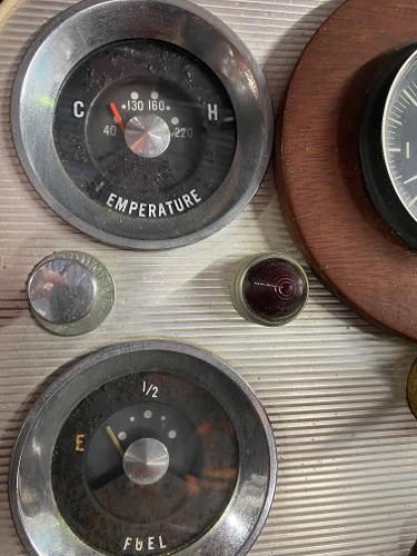 Slide: The Image of 1959 Chris-Craft Sportsman dashboard with temperature and fuel gauges. - 11