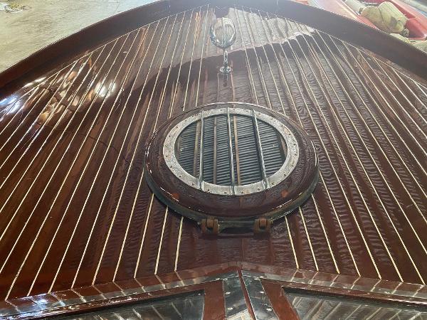 Slide: The Image of 1959 Chris-Craft Sportsman boat with polished wooden deck and circular vent. - 13